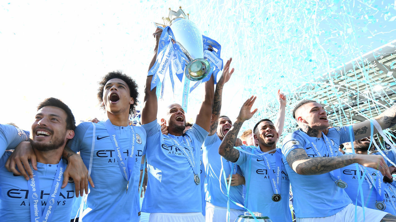 BRIGHTON, ENGLAND - MAY 12: Vincent Kompany of Manchester City lifts the Premier League Trophy after winning the title during the Premier League match between Brighton & Hove Albion and Manchester City at American Express Community Stadium on May 12, 2019 in Brighton, United Kingdom.