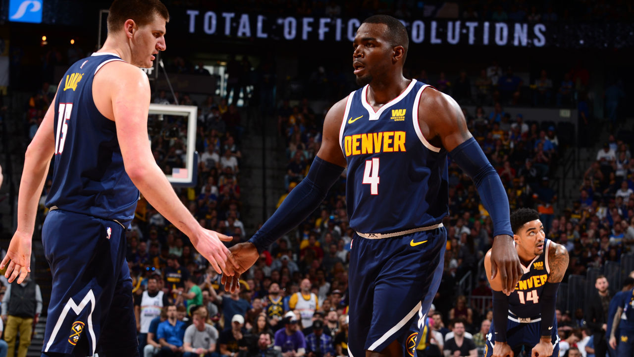 DENVER, CO - MAY 12: Nikola Jokic #15 of the Denver Nuggets high-fives Paul Millsap #4 of the Denver Nuggets against the Portland Trail Blazers during Game Seven of the Western Conference Semifinals of the 2019 NBA Playoffs on May 12, 2019 at the Pepsi Center in Denver, Colorado. NOTE TO USER: User expressly acknowledges and agrees that, by downloading and/or using this Photograph, user is consenting to the terms and conditions of the Getty Images License Agreement. Mandatory Copyright Notice: Copyright 2019 NBAE