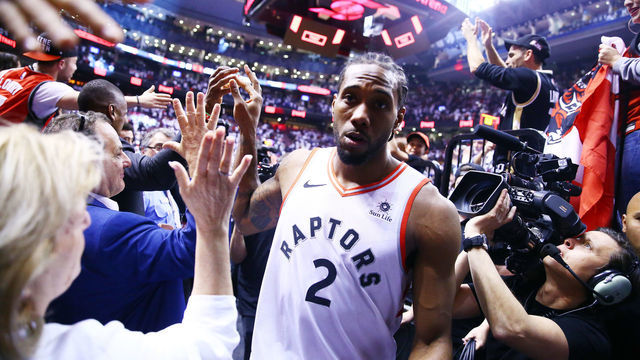 TORONTO, ON - MAY 12: Kawhi Leonard #2 of the Toronto Raptors leaves the court after sinking a buzzer beater to win Game Seven of the second round of the 2019 NBA Playoffs against the Philadelphia 76ers at Scotiabank Arena on May 12, 2019 in Toronto, Canada.