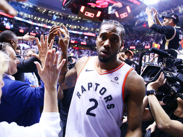 TORONTO, ON - MAY 12: Kawhi Leonard #2 of the Toronto Raptors leaves the court after sinking a buzzer beater to win Game Seven of the second round of the 2019 NBA Playoffs against the Philadelphia 76ers at Scotiabank Arena on May 12, 2019 in Toronto, Canada.