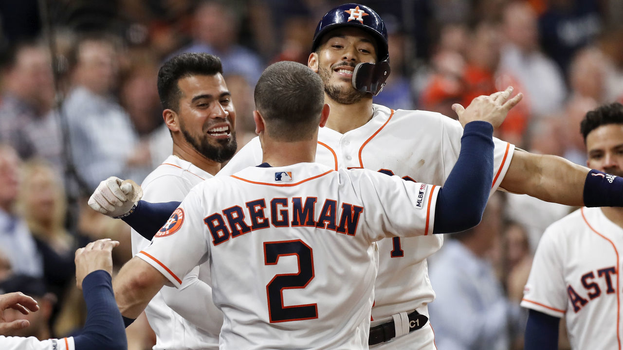 HOUSTON, TX - MAY 08: Alex Bregman #2 of the Houston Astros congratulates Carlos Correa #1 after a home run in the third inning against the Kansas City Royals at Minute Maid Park on May 8, 2019 in Houston, Texas.