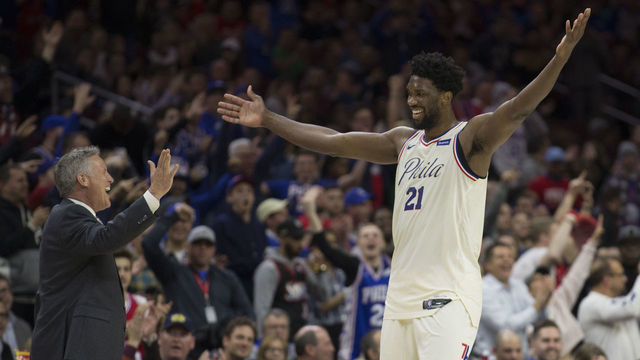 PHILADELPHIA, PA - MARCH 2: Head coach Brett Brown of the Philadelphia 76ers celebrates with Joel Embiid #21 in the fourth quarter against the Charlotte Hornets at the Wells Fargo Center on March 2, 2018 in Philadelphia, Pennsylvania. The 76ers defeated the Hornets 110-99.