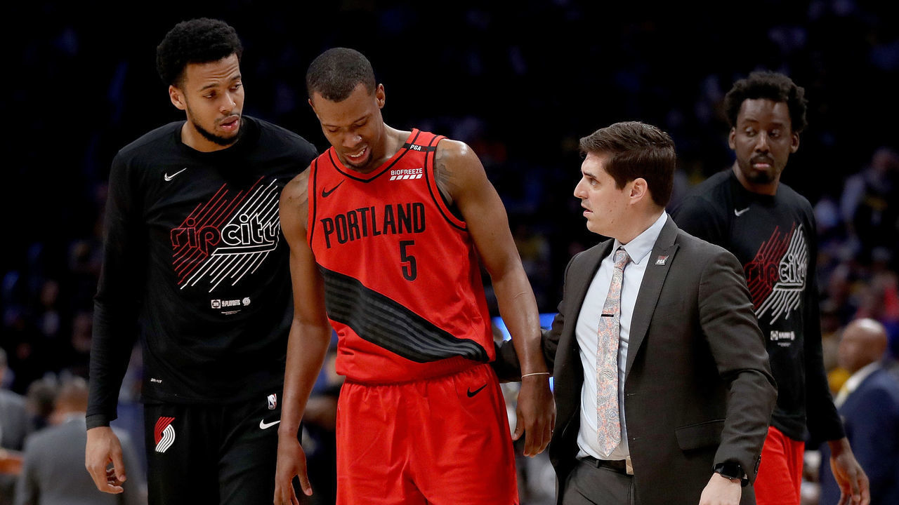 DENVER, COLORADO - MAY 12: Rodney Hood #5 of the Portland Trail Blazers is helped off the floor after being injured against the Denver Nuggets in the third quarter during Game Seven of the Western Conference Semi-Finals of the 2019 NBA Playoffs at the Pepsi Center on May 12, 2019 in Denver, Colorado.