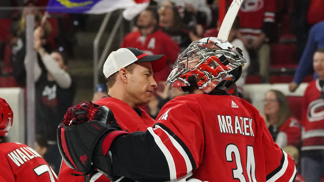 RALEIGH, NC - APRIL 04: Carolina Hurricanes Goalie Curtis McElhinney (35) and Carolina Hurricanes Goalie Petr Mrazek (34) celebrate after the Carolina Hurricanes clinch their first playoff birth since 2009 during a game between the New Jersey Devils and the Carolina Hurricanes at the PNC Arena in Raleigh, NC on April 4, 2019.