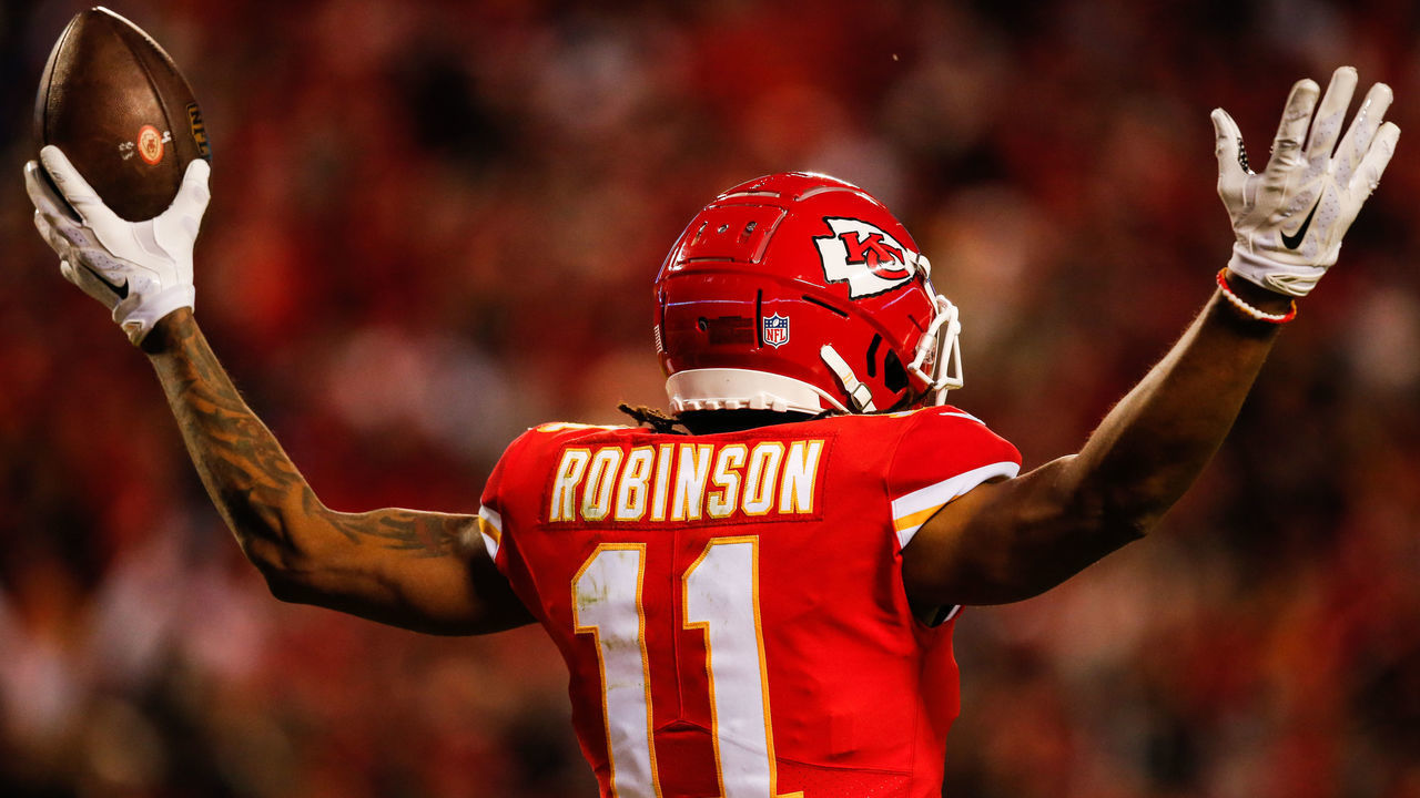KANSAS CITY, MO - DECEMBER 30:Demarcus Robinson #11 of the Kansas City Chiefs puts his arms up after catching the fiftieth touchdown pass of the season for his quarterback Patrick Mahomes #15 during the third quarter of the game against the Oakland Raiders at Arrowhead Stadium on December 30, 2018 in Kansas City, Missouri.
