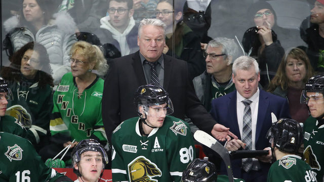 LONDON, ON - FEBRUARY 13: Head coach Dale Hunter of the London Knights and assistant coach Rick Steadman look on from behind the bench during OHL game action against the Guelph Storm at Budweiser Gardens on February 13, 2019 in London, Canada.