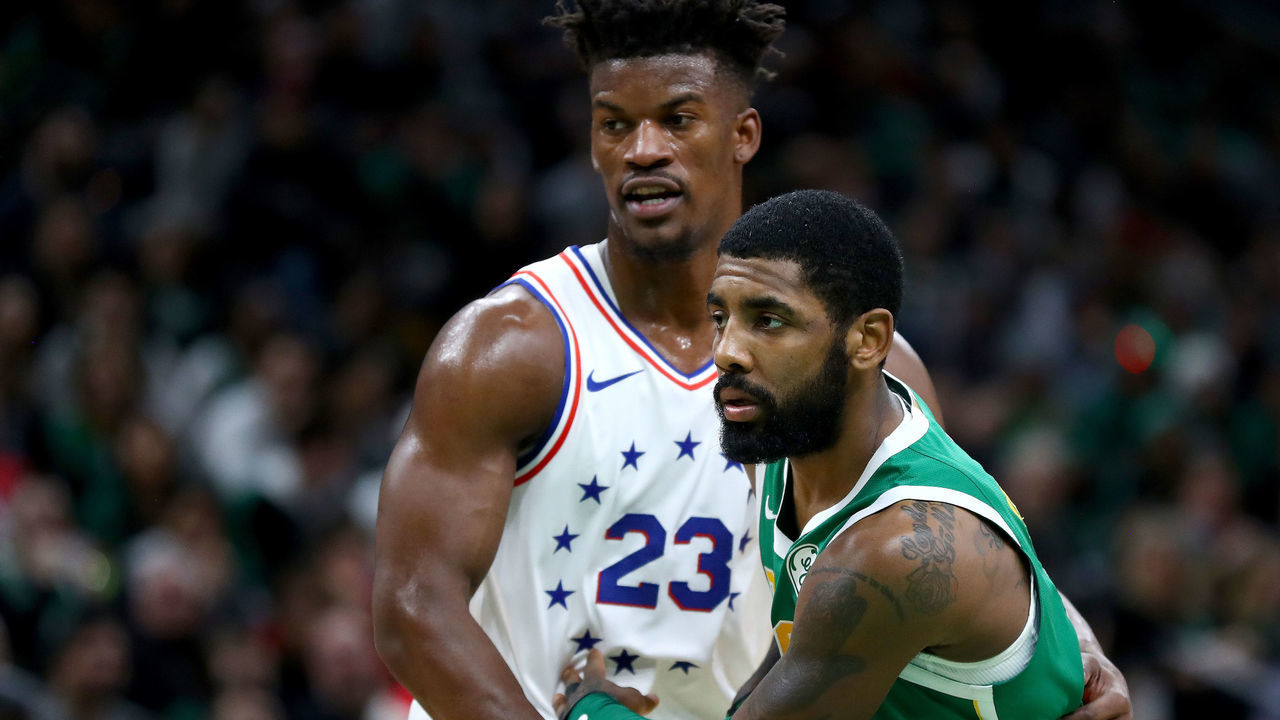 BOSTON, MASSACHUSETTS - DECEMBER 25: Kyrie Irving #11 of the Boston Celtics fights for position against Jimmy Butler #23 of the Philadelphia 76ers during the third quarter at TD Garden on December 25, 2018 in Boston, Massachusetts.