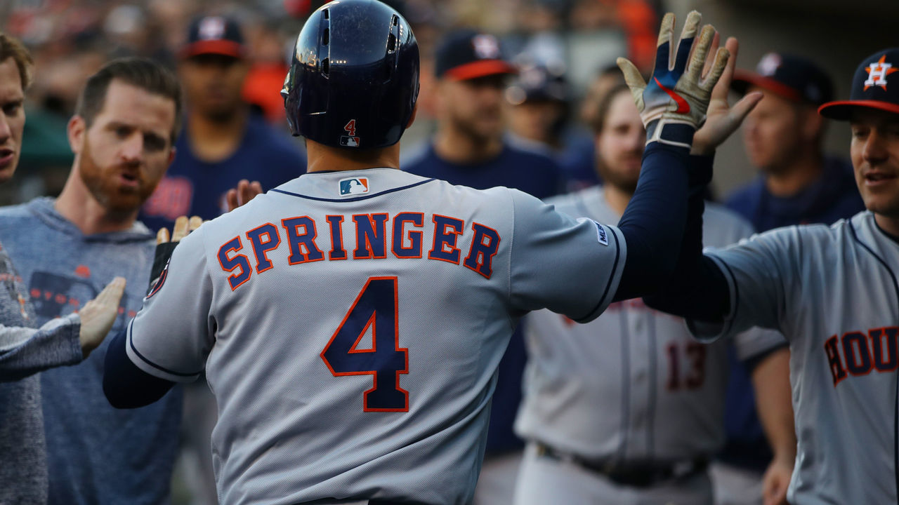DETROIT, MICHIGAN - MAY 14: George Springer #4 of the Houston Astros celebrates scoring a run in the second inning while playing the Detroit Tigers at Comerica Park on May 14, 2019 in Detroit, Michigan.
