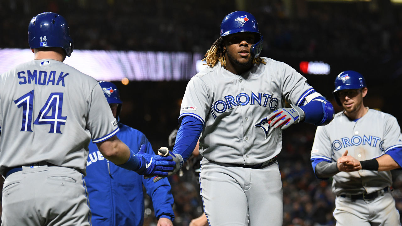 SAN FRANCISCO, CALIFORNIA - MAY 14: Vladimir Guerrero Jr. #27 of the Toronto Blue Jays celebrates with Justin Smoak #14 after hitting a three-run home run against the San Francisco Giants in the sixth inning of their MLB game at Oracle Park on May 14, 2019 in San Francisco, California.