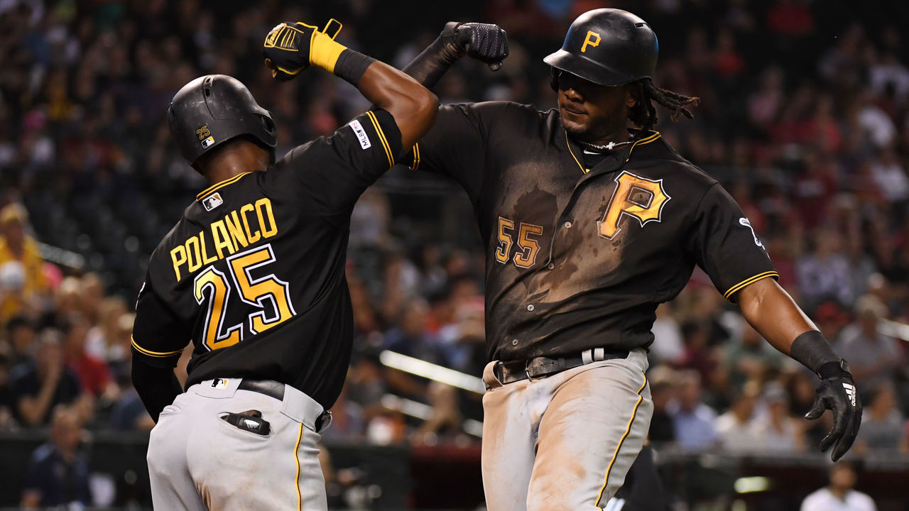 PHOENIX, ARIZONA - MAY 14: Josh Bell #55 of the Pittsburgh Pirates celebrates with teammate Gregory Polanco #25 after hitting a two run home run off of Luke Weaver #24 of the Arizona Diamondbacks during the fifth inning at Chase Field on May 14, 2019 in Phoenix, Arizona.