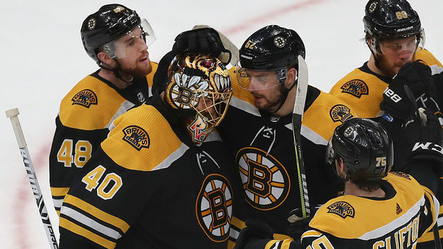 BOSTON - MAY 9: Boston Bruins goalie Tuukka Rask (40) gets a hug from teammate Sean Kuraly (52) at the end of the game. The Boston Bruins host the Carolina Hurricanes in Game 1 of the NHL Eastern Conference Finals on May 9, 2019.
