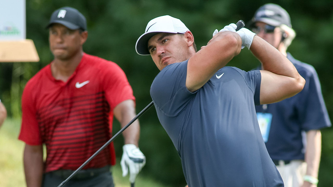 NORTON, MA - SEPTEMBER 03: Brooks Koepka (USA) on the tee at 15 watched by Tiger Woods (USA) during the final round of the Dell Technologies Championship on September 03, 2018 at the TPC Boston in Norton, Massachusetts.