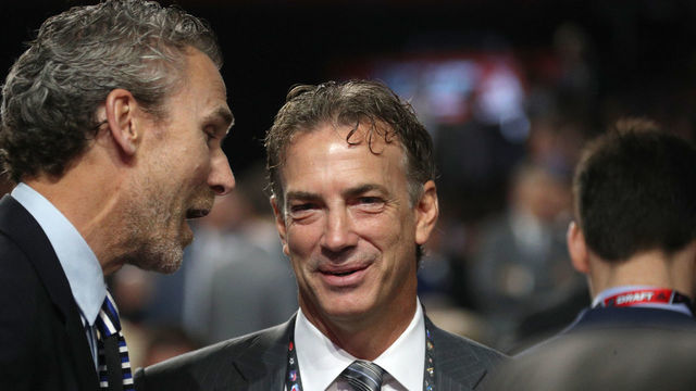 CHICAGO, IL - JUNE 24: General manager Joe Sakic of the Colorado Avalanche listens to president of hockey operations Trevor Linden of the Vancouver Canucks on the draft floor during the 2017 NHL Draft at United Center on June 24, 2017 in Chicago, Illinois.