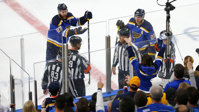 ST LOUIS, MISSOURI - MAY 15: Matt MacPherson #83, linesman Jonny Murray #95 and referee Dan O'Rourke #9 discuss a possible hand pass game winning overtime goal scored by Erik Karlsson #65 of the San Jose Sharks against the St. Louis Blues in overtime of Game Three of the Western Conference Finals during the 2019 NHL Stanley Cup Playoffs at Enterprise Center on May 15, 2019 in St Louis, Missouri.