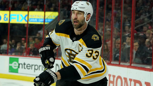 RALEIGH, NC - MAY 14: Zdeno Chara #33 of the Boston Bruins plays a puck in the corner in Game Three of the Eastern Conference Third Round against the Carolina Hurricanes during the 2019 NHL Stanley Cup Playoffs on May 14, 2019 at PNC Arena in Raleigh, North Carolina.