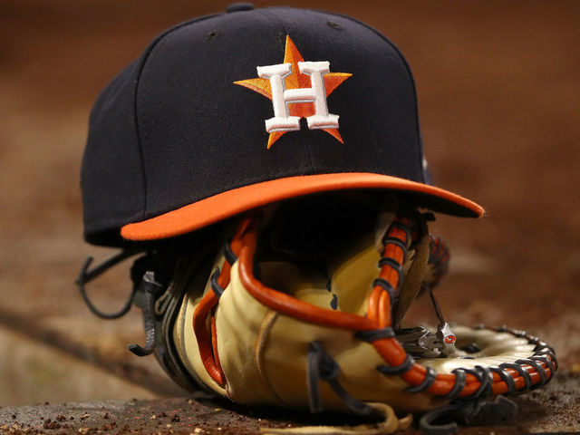 ANAHEIM, CA - JULY 20: A detailed view of a Houston Astros hat is seen in the Houston Astros dugout during the ninth inning of the MLB game between the Houston Astros and the Los Angeles Angels of Anaheim at Angel Stadium on July 20, 2018 in Anaheim, California. The Astros defeated the Angels 3-1.