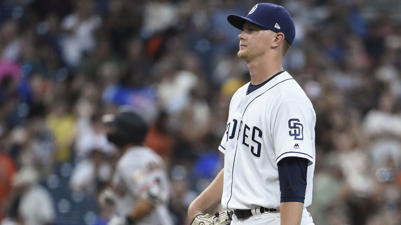 SAN DIEGO, CA - JULY 30: Eric Lauer #46 of the San Diego Padres looks toward the plate after giving up a three-run home run to Chase d'Arnaud #2 of the San Francisco Giants during the second inning of a baseball game PETCO Park on July 30, 2018 in San Diego, California.
