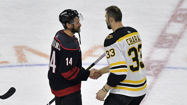 RALEIGH, NORTH CAROLINA - MAY 16: Zdeno Chara #33 of the Boston Bruins shakes hands with Justin Williams #14 of the Carolina Hurricanes after defeating the Carolina Hurricanes in Game Four to win the Eastern Conference Finals during the 2019 NHL Stanley Cup Playoffs at PNC Arena on May 16, 2019 in Raleigh, North Carolina.