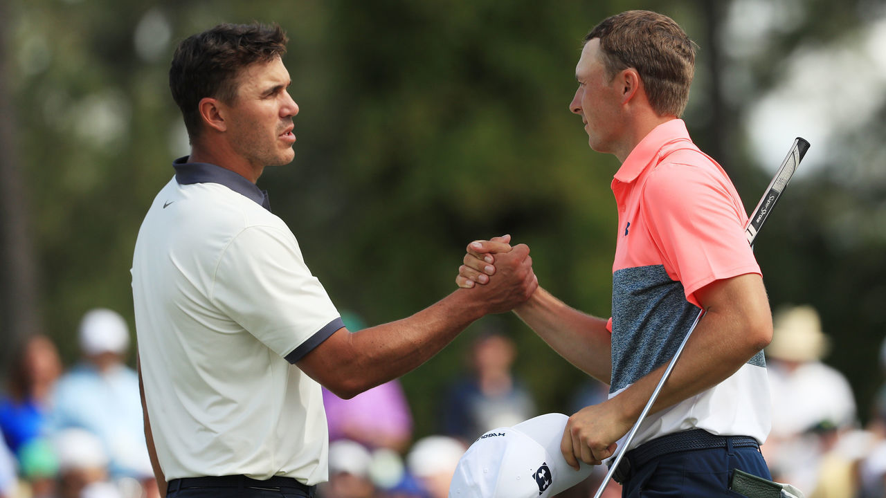 AUGUSTA, GEORGIA - APRIL 12: Brooks Koepka and Jordan Spieth of the United States shake hands after finishing on the 18th green during the second round of the Masters at Augusta National Golf Club on April 12, 2019 in Augusta, Georgia.