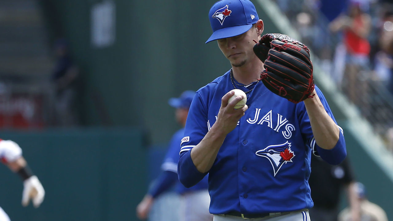 ARLINGTON, TX - MAY 5: Clay Buchholz #36 of the Toronto Blue Jays reacts after giving up a two-run home run to Rougned Odor #12 of the Texas Rangers during the second inning at Globe Life Park in Arlington on May 5, 2019 in Arlington, Texas.