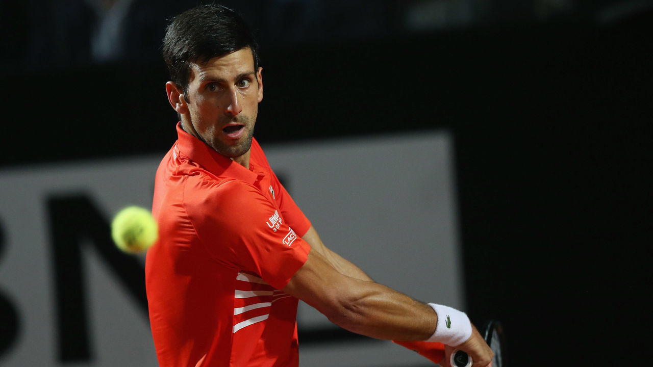 ROME, ITALY - MAY 18: Novak Djokovic of Serbia plays a backhand against Diego Schwartzman of Argentina in their Men's singles semi-final match during Day seven of the International BNL d'Italia at Foro Italico on May 18, 2019 in Rome, Italy.