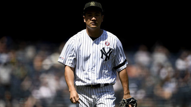 NEW YORK, NEW YORK - MAY 18: Masahiro Tanaka #19 of the New York Yankees walks toward the dugout after pitching during the first inning of the game against the Tampa Bay Rays at Yankee Stadium on May 18, 2019 in the Bronx borough of New York City.