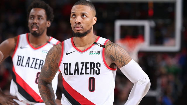 PORTLAND, OR - MAY 18: Damian Lillard #0 of the Portland Trail Blazers looks on during the game against the Golden State Warriors during Game Three of the Western Conference Finals of the 2019 NBA Playoffs on May 18, 2019 at the Moda Center in Portland, Oregon. Mandatory Copyright Notice: Copyright 2019 NBAE