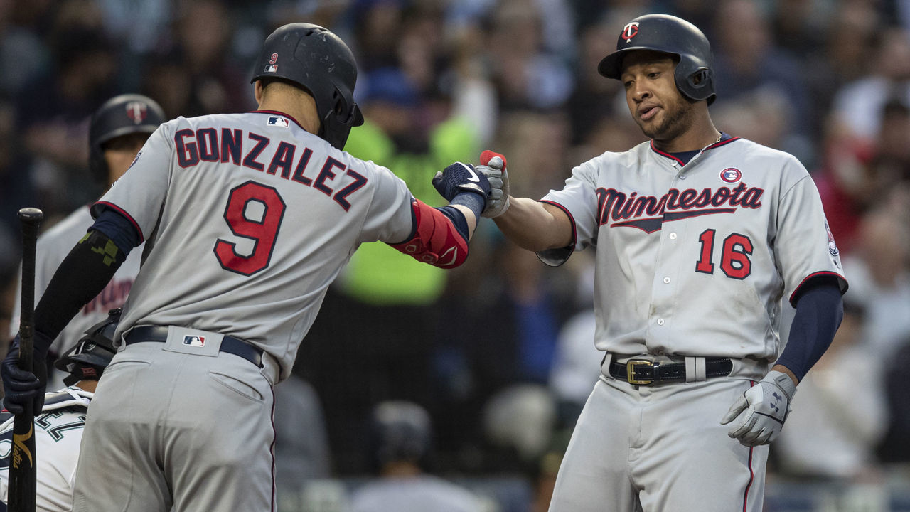 SEATTLE, WA - MAY 18: Jonathan Schoop #16 of the Minnesota Twins is congratulated by Marwin Gonzalez #9 of the Minnesota Twins after hitting three-run home run off of relief pitcher Parker Markel #37 of the Seattle Mariners that also scored Jason Castro #15 of the Minnesota Twins and Jorge Polanco #11 during the third inning of a a game at T-Mobile Park on May 18, 2019 in Seattle, Washington.