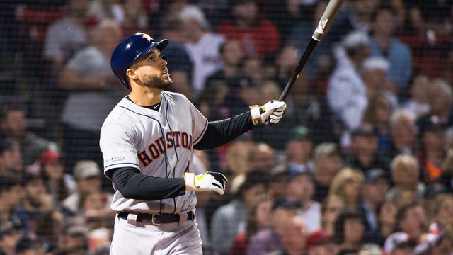 BOSTON, MA - MAY 17: George Springer #4 of the Houston Astros hits a two run home run in the eighth inning against the Boston Red Sox at Fenway Park on May 17, 2019 in Boston, Massachusetts.