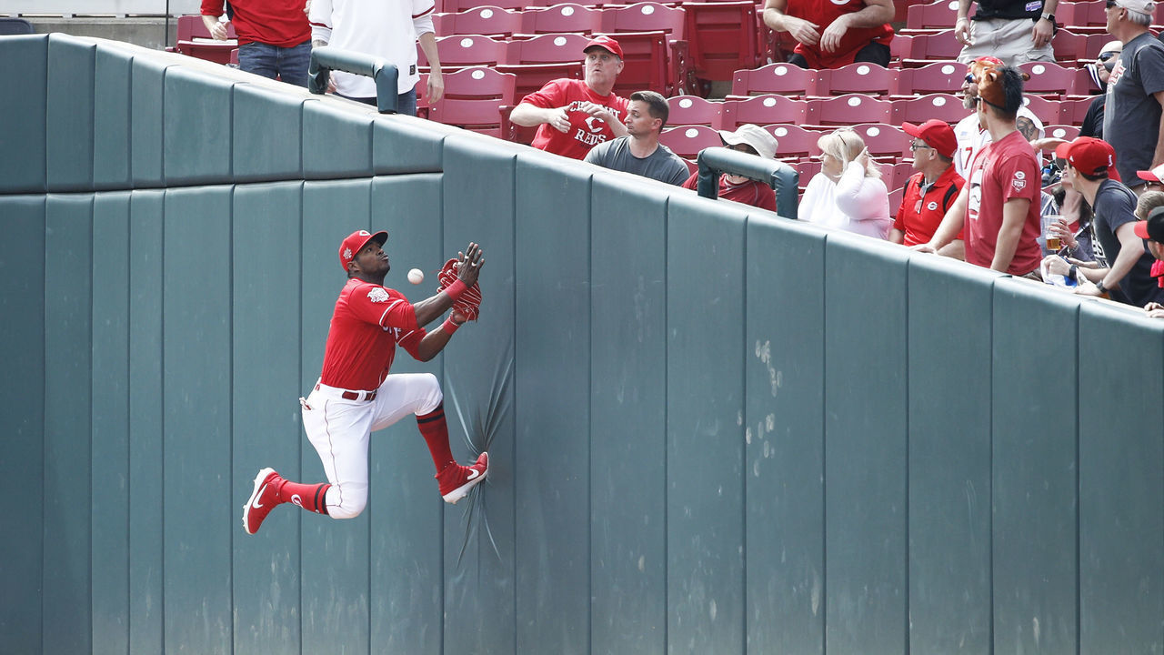 CINCINNATI, OH - APRIL 11: Yasiel Puig #66 of the Cincinnati Reds tries to catch a ball up against the right field wall in foul territory during a game against the Miami Marlins at Great American Ball Park on April 11, 2019 in Cincinnati, Ohio. The Reds won 5-0.