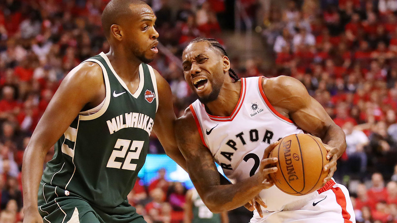 TORONTO, ONTARIO - MAY 19: Kawhi Leonard #2 of the Toronto Raptors handles the ball against Khris Middleton #22 of the Milwaukee Bucks during the second half in game three of the NBA Eastern Conference Finals at Scotiabank Arena on May 19, 2019 in Toronto, Canada.