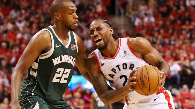 TORONTO, ONTARIO - MAY 19: Kawhi Leonard #2 of the Toronto Raptors handles the ball against Khris Middleton #22 of the Milwaukee Bucks during the second half in game three of the NBA Eastern Conference Finals at Scotiabank Arena on May 19, 2019 in Toronto, Canada.