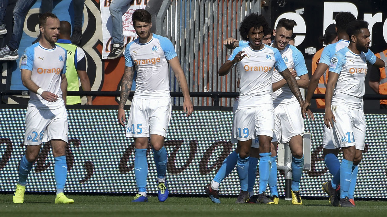 Marseille players celebrate their second goal during the French L1 football match between Guingamp (EAG) and Olympique de Marseille (OM) at the Roudourou stadium in Guingamp, western France, on April 20, 2019.