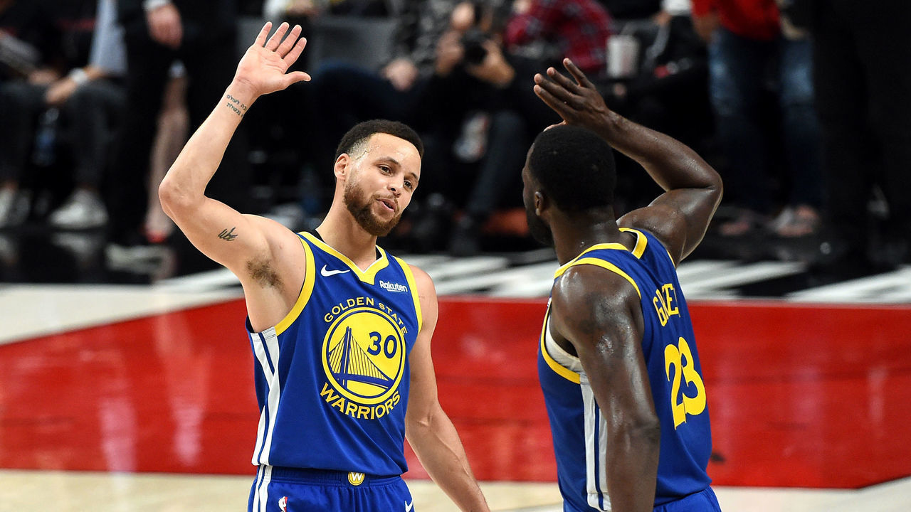 PORTLAND, OREGON - MAY 18: Stephen Curry #30 of the Golden State Warriors celebrates with Draymond Green #23 during the second half against the Portland Trail Blazers in game three of the NBA Western Conference Finals at Moda Center on May 18, 2019 in Portland, Oregon.