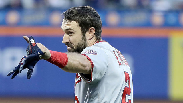 NEW YORK, NEW YORK - MAY 20: Adam Eaton #2 of the Washington Nationals is kept back by first base umpire Mike Estabrook #83 as Eaton was arguing with Todd Frazier of the New York Mets at the end of the third inning at Citi Field on May 20, 2019 in the Flushing neighborhood of the Queens borough of New York City.