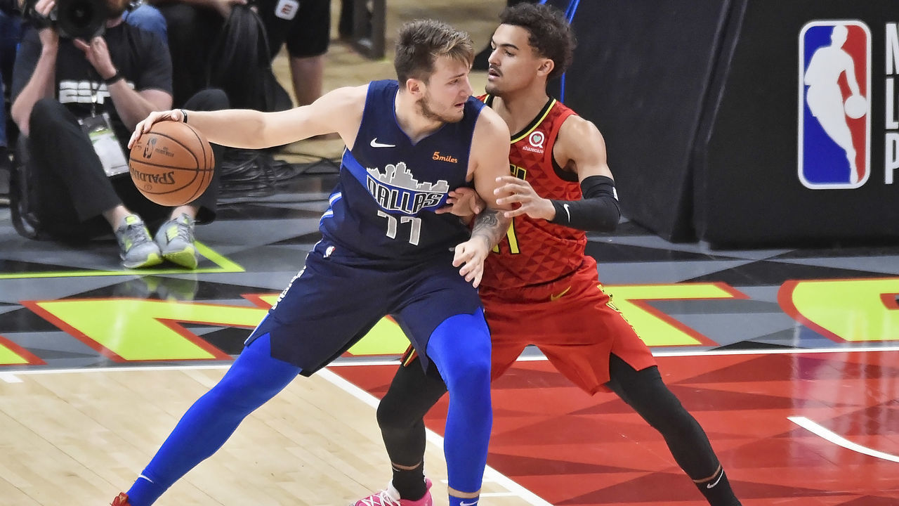 ATLANTA, GA - OCTOBER 24: Atlanta Hawks guard Trae Young (right) defends Dallas Mavericks guard Luka Doncic (left) during the third quarter of a NBA game on October 24, 2018 at State Farm Arena in Atlanta, GA.