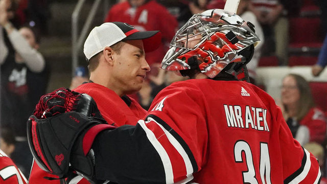 RALEIGH, NC - APRIL 04: Carolina Hurricanes Goalie Curtis McElhinney (35) and Carolina Hurricanes Goalie Petr Mrazek (34) celebrate after the Carolina Hurricanes clinch their first playoff birth since 2009 during a game between the New Jersey Devils and the Carolina Hurricanes at the PNC Arena in Raleigh, NC on April 4, 2019.