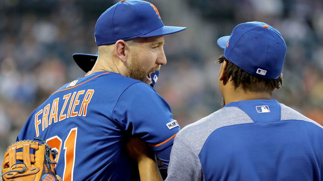 NEW YORK, NEW YORK - MAY 20: Todd Frazier #21 of the New York Mets is held back by teammates Juan Lagares #12 and Dominic Smith #22 as he and Adam Eaton #2 of the Washington Nationals have a heated discussion in the third inning at Citi Field on May 20, 2019 in the Flushing neighborhood of the Queens borough of New York City.