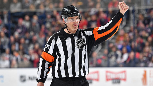 COLUMBUS, OH - FEBRUARY 14: Referee Wes McCauley #4 officiates a game between the New York Islanders and the Columbus Blue Jackets on February 14, 2019 at Nationwide Arena in Columbus, Ohio.