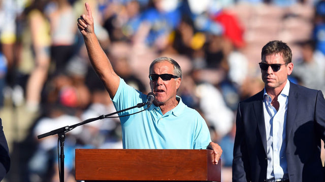 28 November 2014: Former UCLA football coach Terry Donahue introduces NFL Hall of Famer Troy Aikman during the ceremony to retire his #8 UCLA jersey during an NCAA football game between the Stanford Cardinal and the UCLA Bruins at the Rose Bowl in Pasadena, CA.