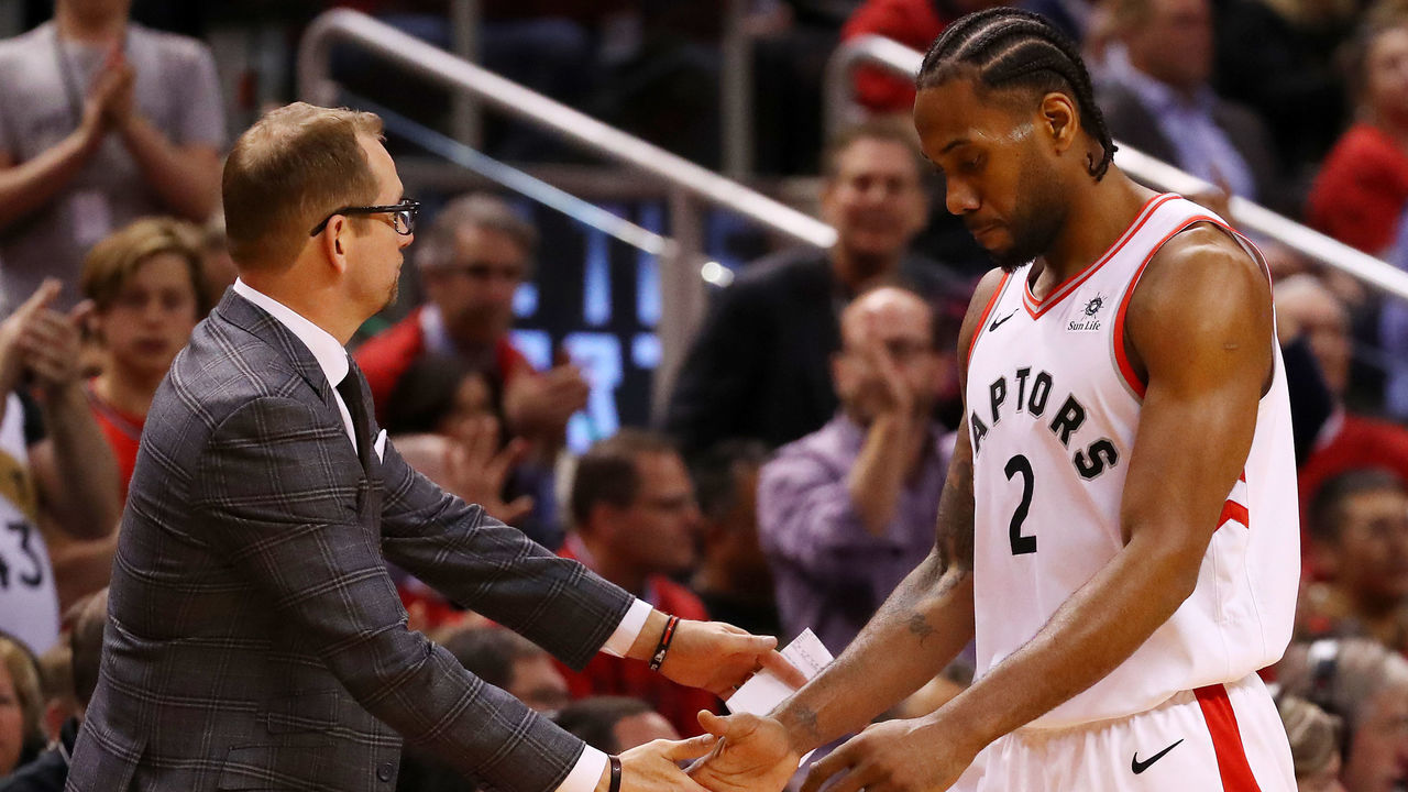 TORONTO, ONTARIO - MAY 21: Kawhi Leonard #2 of the Toronto Raptors high fives head coach Nick Nurse of the Toronto Raptors in game four of the NBA Eastern Conference Finals against the Milwaukee Bucks at Scotiabank Arena on May 21, 2019 in Toronto, Canada.