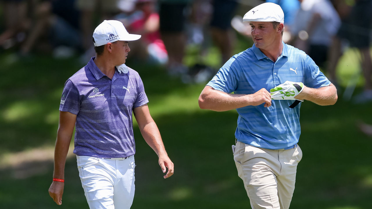 FORT WORTH, TX - MAY 25: Bryson DeChambeau and Rickie Fowler talk as they walk up the 5th fairway during the second round of the Fort Worth Invitational on May 25, 2018 at Colonial Country Club in Fort Worth, TX.