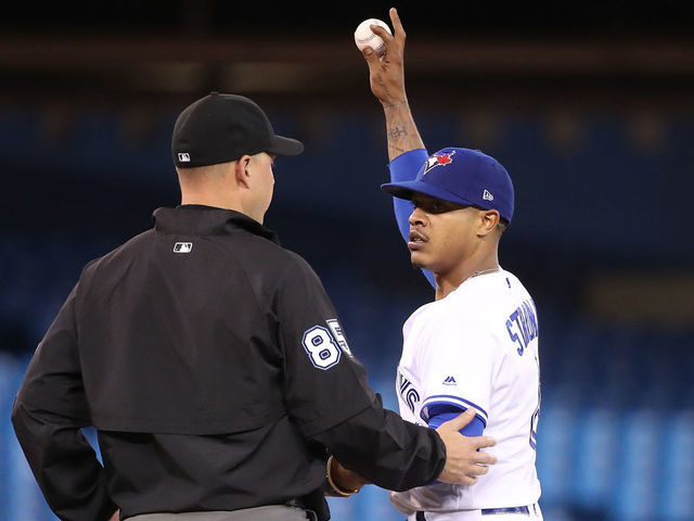 TORONTO, ON - MAY 21: Second base umpire Stu Scheurwater talks to #85 Marcus Stroman #6 of the Toronto Blue Jays in the fourth inning as he reacts to heckling from the Red Sox dugout by Michael Chavis #23 of the Boston Red Sox during MLB game action at Rogers Centre on May 21, 2019 in Toronto, Canada.