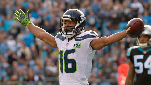 CHARLOTTE, NC - NOVEMBER 25: Tyler Lockett #16 of the Seattle Seahawks celebrates a touchdown against the Carolina Panthers in the third quarter during their game at Bank of America Stadium on November 25, 2018 in Charlotte, North Carolina.
