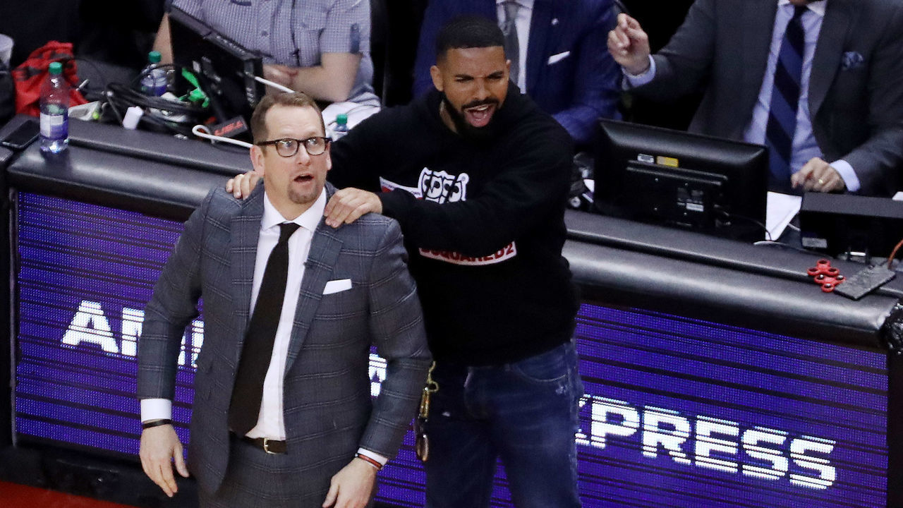 TORONTO, ON- MAY 21 - Drake massages Toronto Raptors head coach Nick Nurse's shoulder as the Toronto Raptors beat the Milwaukee Bucks in game four 120-102 to even up the Eastern Conference NBA Final at two games each at Scotiabank Arena in Toronto. May 21, 2019. (Steve Russell/Toronto Star via Getty Images)
