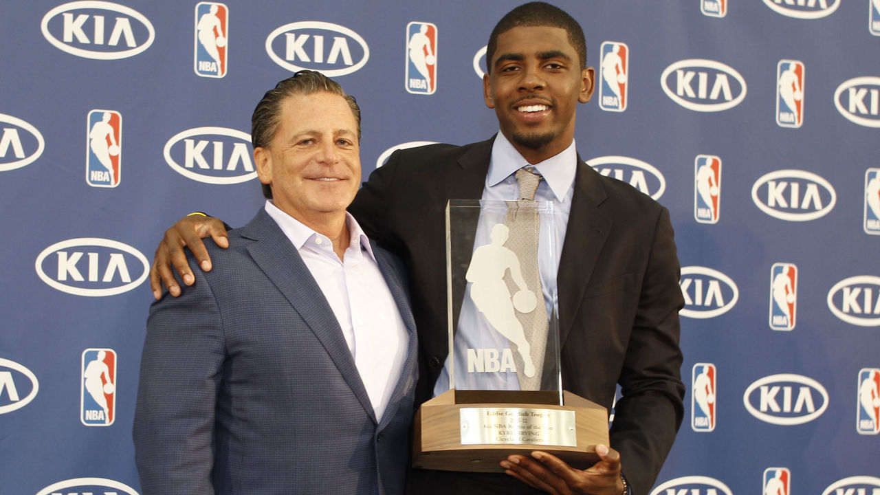 INDEPENDENCE, OH - MAY 15: Owner Dan Gilbert and Kyrie Irving #2 of the Cleveland Cavaliers poses for a portrait as Kyrie is the recipient of the Eddie Gottlieb Trophy as the 2011-12 Kia NBA Rookie of the Year on May 15, 2012 at Cleveland Clinic Courts in Independence, Ohio. NOTE TO USER: User expressly acknowledges and agrees that, by downloading and/or using this photograph, user is consenting to the terms and conditions of the Getty Images License Agreement. Mandatory Copyright Notice: Copyright 2012 NBAE
