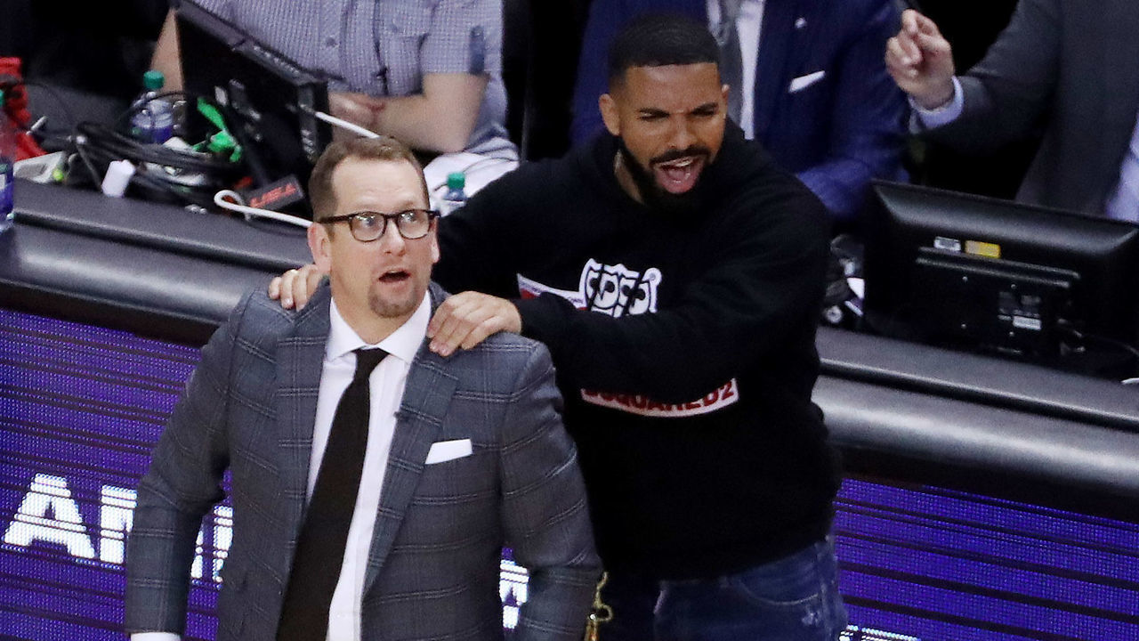 TORONTO, ON- MAY 21 - Drake massages Toronto Raptors head coach Nick Nurse's shoulder as the Toronto Raptors beat the Milwaukee Bucks in game four 120-102 to even up the Eastern Conference NBA Final at two games each at Scotiabank Arena in Toronto. May 21, 2019. (Steve Russell/Toronto Star via Getty Images)