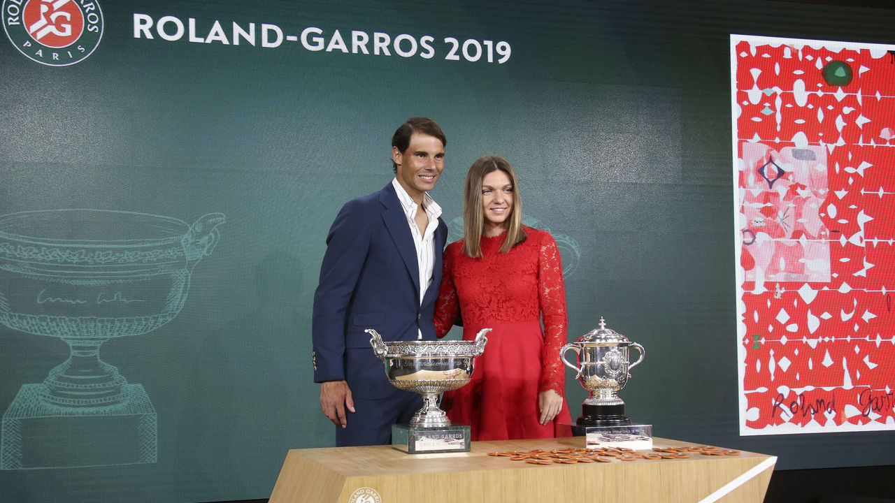 PARIS, FRANCE - MAY 23: 2018 French Open champions Rafael Nadal of Spain and Simona Halep of Romania pose for photos during the draw of the 2019 French Open at Roland Garros stadium on May 23, 2019 in Paris, France.