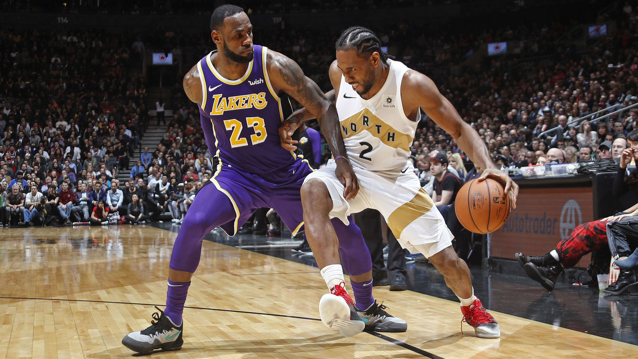 TORONTO, CANADA - MARCH 14: Kawhi Leonard #2 of the Toronto Raptors handles the ball against LeBron James #23 of the Los Angeles Lakers on March 14, 2019 at the Scotiabank Arena in Toronto, Ontario, Canada. Mandatory Copyright Notice: Copyright 2019 NBAE