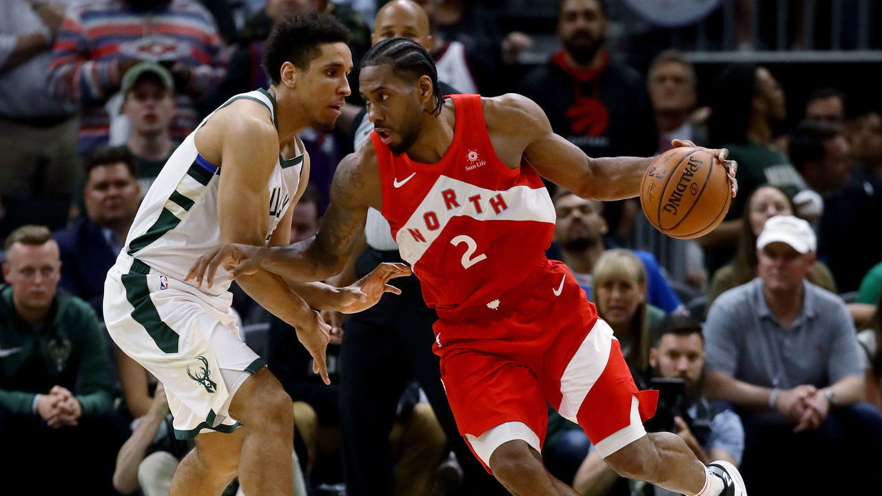 MILWAUKEE, WISCONSIN - MAY 23: Kawhi Leonard #2 of the Toronto Raptors dribbles the ball while being guarded by Malcolm Brogdon #13 of the Milwaukee Bucks in the fourth quarter during Game Five of the Eastern Conference Finals of the 2019 NBA Playoffs at the Fiserv Forum on May 23, 2019 in Milwaukee, Wisconsin.